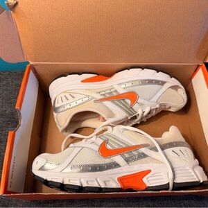 Nike women’s White Sneakers with Bright Orange Swoosh